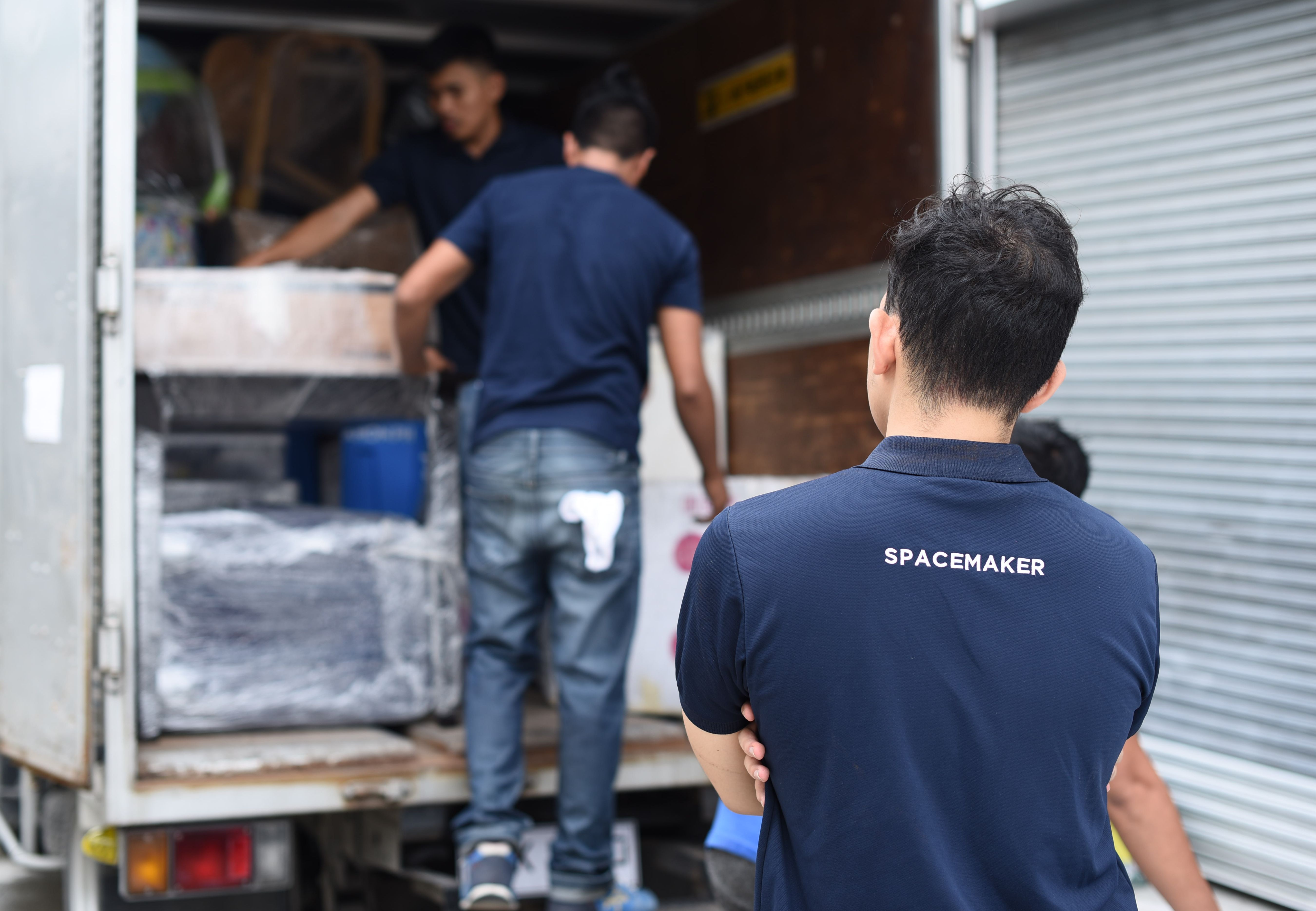 Spacemaker loading items at the back of a truck